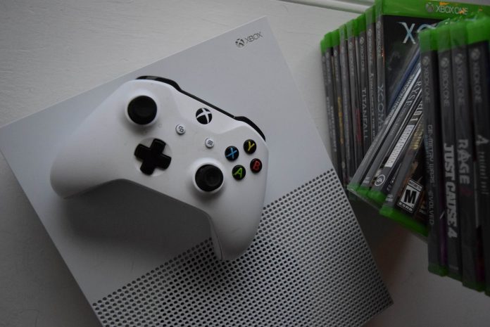 How To Eject Disc From Xbox One – Comprehensive Guide - A White XBoxOne with Game Discs